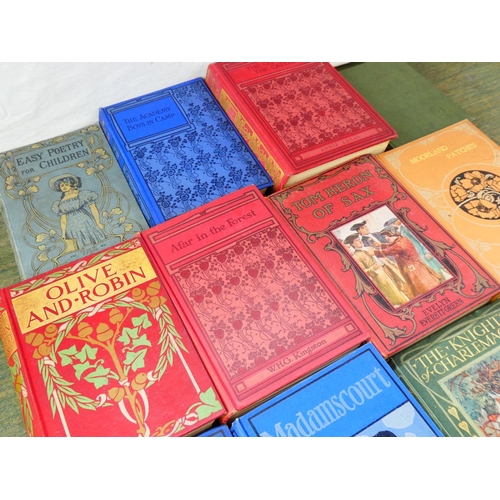 122 - A collection of ten antique children's hardback books decorated in art nouveau/arts & crafts style a... 