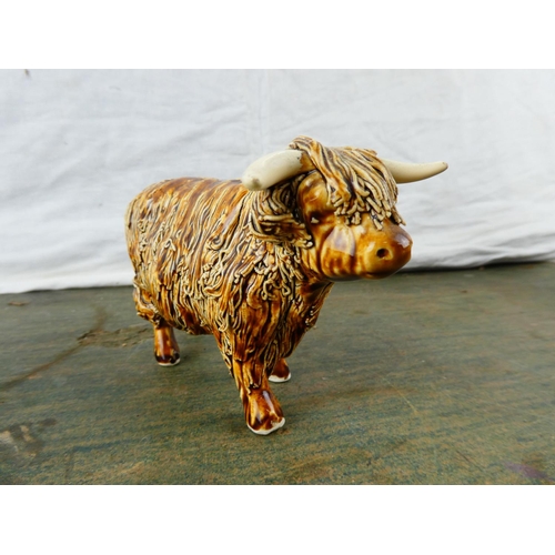 146 - An ceramic figure of a highland cow.