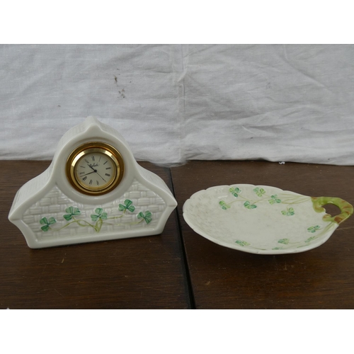 155 - A Belleek mantle clock and plate.