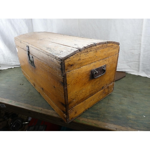 175 - An antique wooden dome topped storage chest.