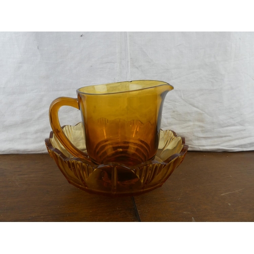 184 - A vintage amber glass fruit bowl and jug.