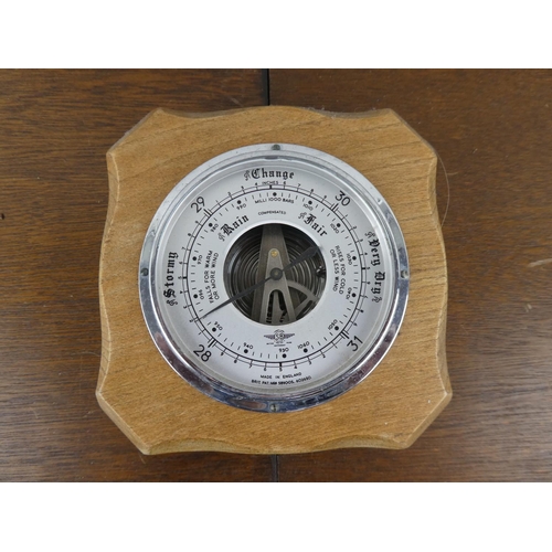 186 - An oak cased barometer. (a/f)