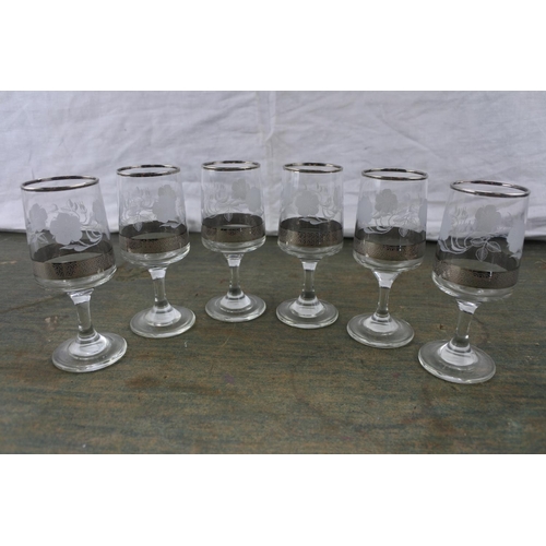 19 - A set of six vintage sherry glasses.