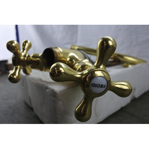 2 - A set of brass taps.