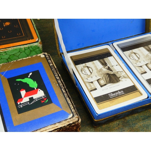 21 - A collection of vintage boxed playing cards.
