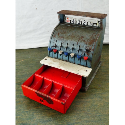 23 - A vintage Codec toy cash register. (a/f)