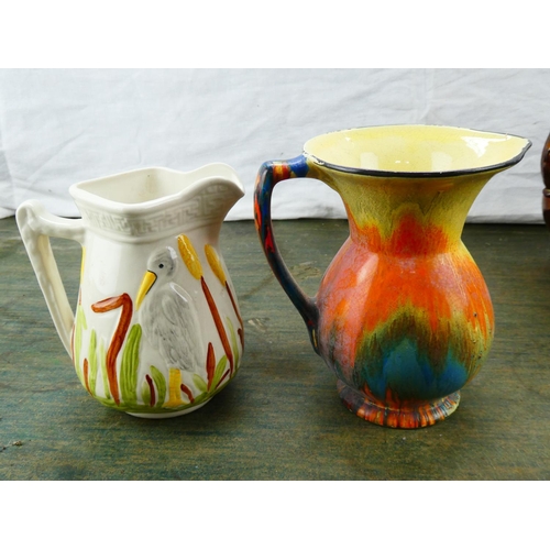 34 - A collection of 4 ceramic jugs.