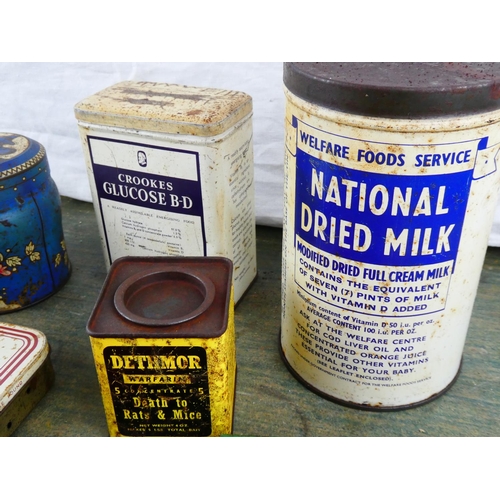 35 - A large collection of vintage advertising tins to include Marmite Cubes, Songster Needles & more.
