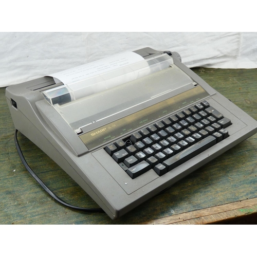49 - A vintage Sharp QL 100 electric typewriter.