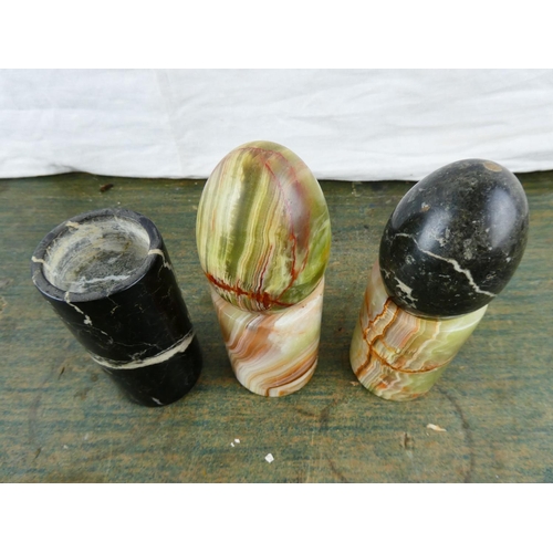 61 - Two marble eggs and three marble tealight holders.