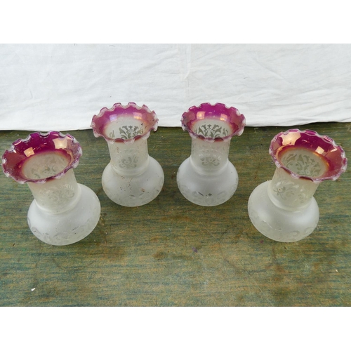 74 - A set of four vintage glass shades.