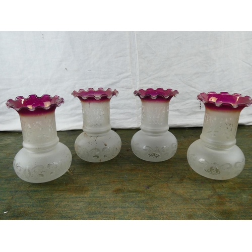 74 - A set of four vintage glass shades.