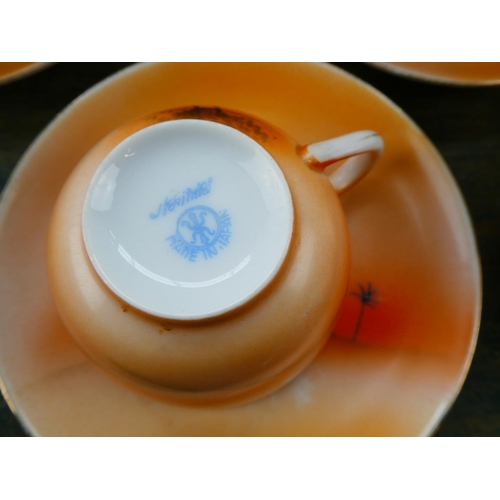 75 - A stunning Noritake tea set (repair to jug).