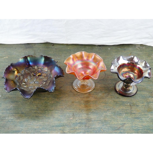 83 - Three pieces of Carnival glass ware.