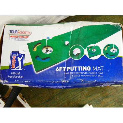 84 - An assortment of boxed golf putting equipment.