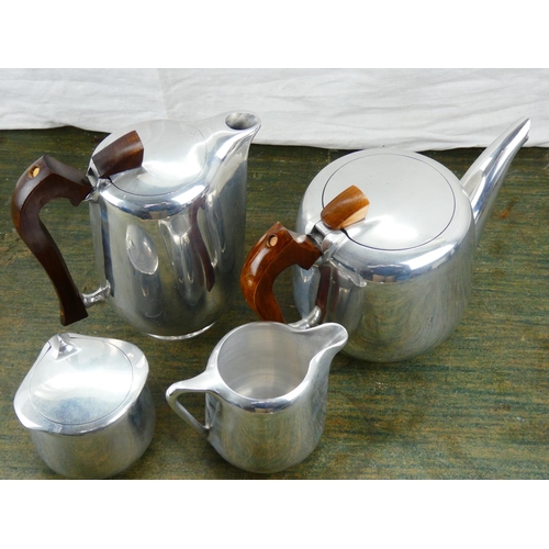 98 - A vintage four piece picquot ware tea service.