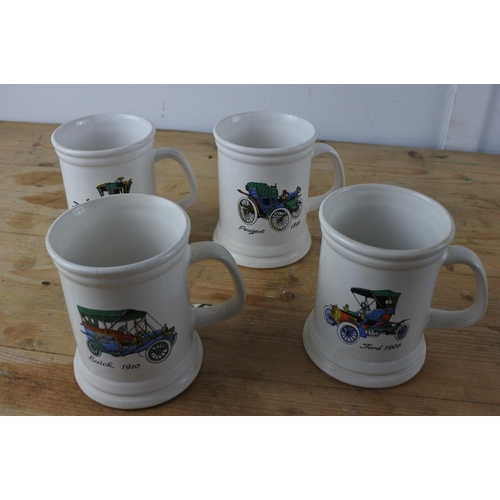 343 - A set of four Ulster Ceramics 'Car' mugs.