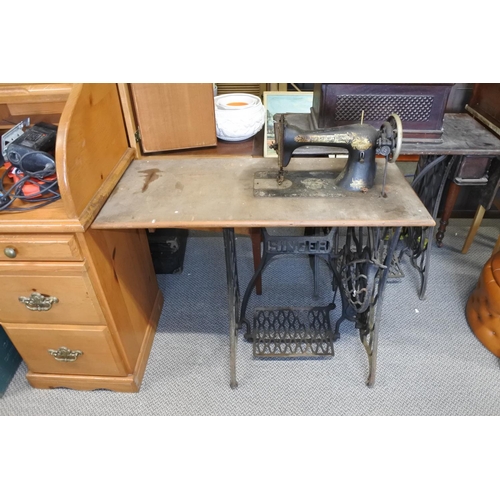 364 - An antique Singer sewing machine with cast iron base.