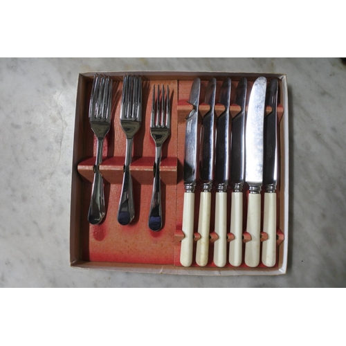 370 - An assortment of vintage cutlery.