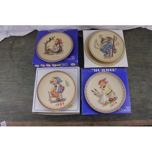 381 - A collection of boxed Goebel Hummel Annual plates dating 1972, 1974, 1978 & 1984.