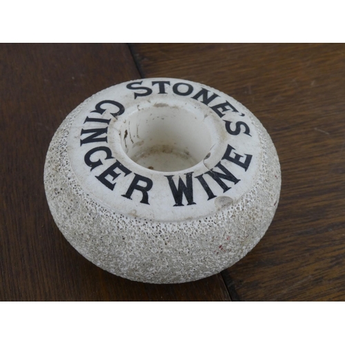 493 - An antique Stones Ginger Wine bar top advertising match striker.