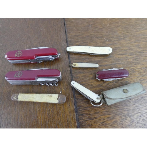 518 - A collection of various pocket knives to include Swiss Army Knives & a James Barber Era piece.