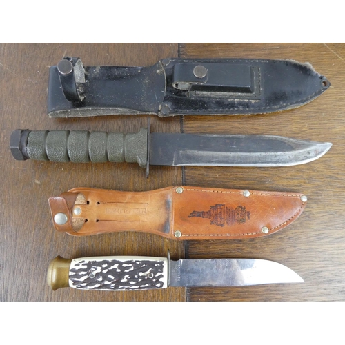 520 - 2 large knives with sheaths.