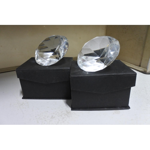 545 - 2 decorative paper weights, modelled as diamonds.