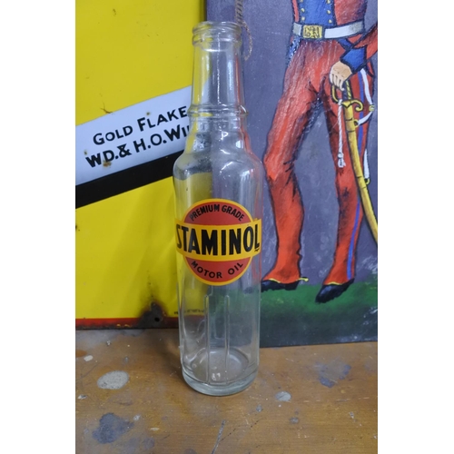564 - A vintage Staminol Motor Oil bottle.