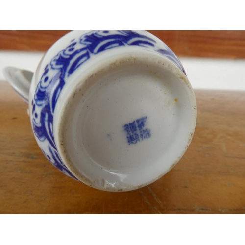 19 - An oriental cup and lid.