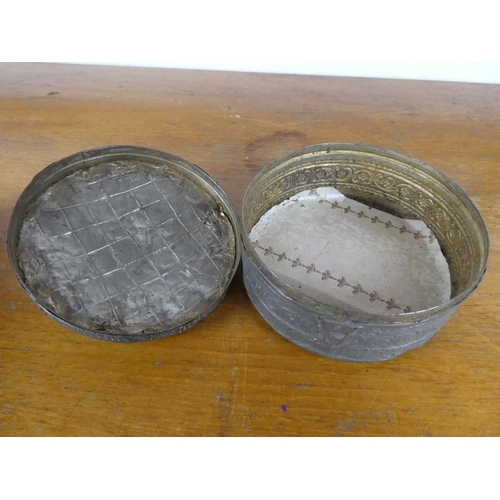 22 - An unusual antique pewter tin with decorative design.