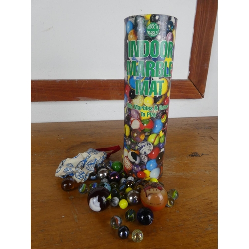 33 - A vintage tube of marbles by House of Marbles.
