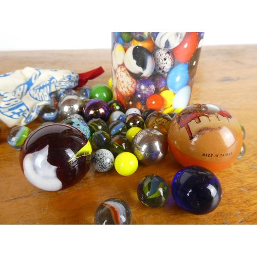 33 - A vintage tube of marbles by House of Marbles.