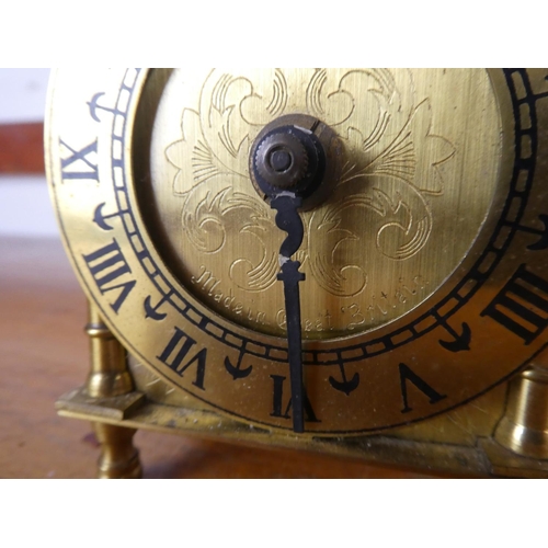 36 - An antique brass Smiths mantle clock.