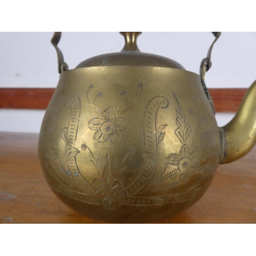 37 - A vintage brass teapot.