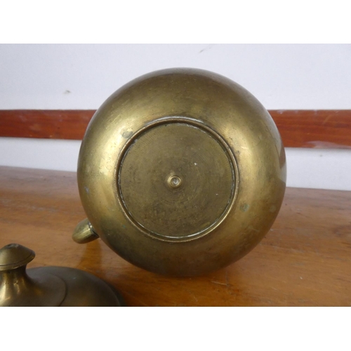 37 - A vintage brass teapot.
