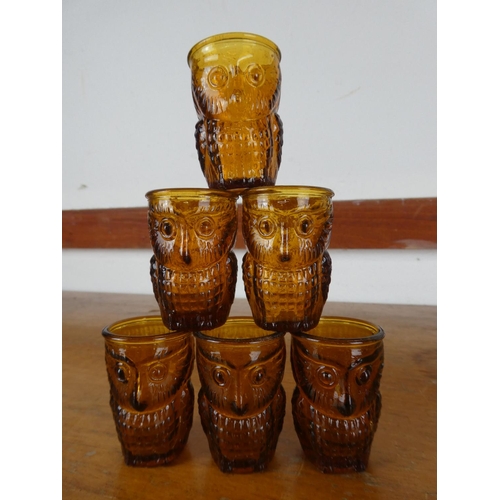 5 - A set of six vintage amber glass shot glasses in the shape of an owl.