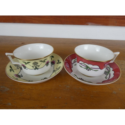 60 - A pair of Wedgwood cabinet cups and saucer from the Georgian Collection 'Austen' and 'Tennyson'.