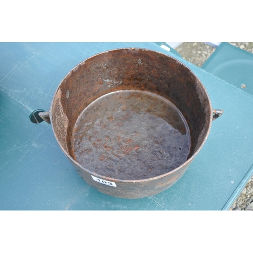 103 - An antique cooking pot, measuring 32cm in diameter.