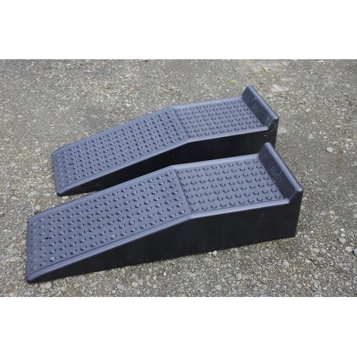 67 - A pair of heavy duty plastic car ramps.