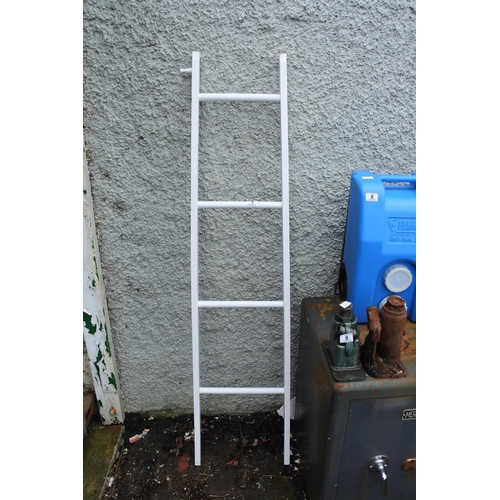 7 - A wooden ladder painted white.