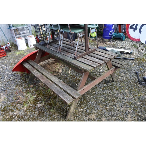 93 - A wooden picnic bench in need of some restoration, measuring 148cm(L) x 130cm(W).
