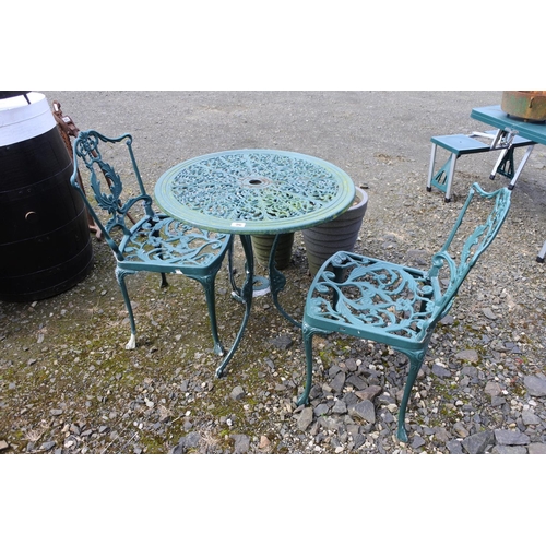 96 - A cast metal bistro table & pair of matching chairs.