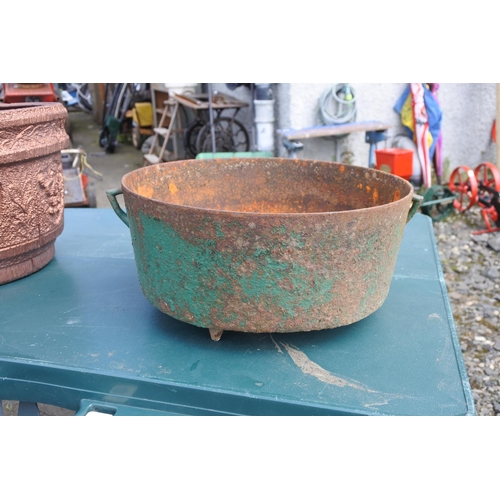 98 - An antique cooking pot.