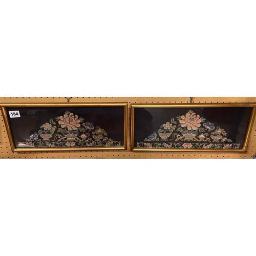 184 - PAIR OF ORIENTAL SILK KNOTTED THREAD STILL LIFE PANELS OF FLOWERS ON A BLACK GROUND F/G