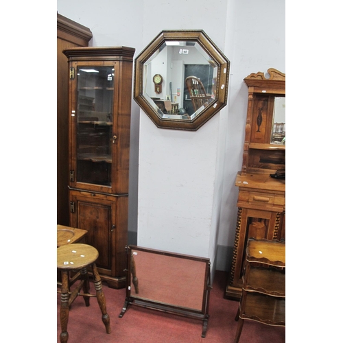 A 1920's Oak Octagonal Wall Mirror, with bevelled glass, together with ...