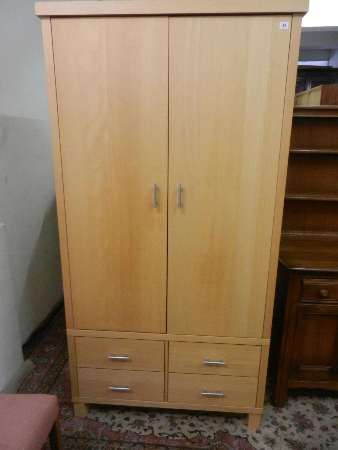 A Modern Light Beech Veneered Wardrobe Fitted Two Doors Enclosing