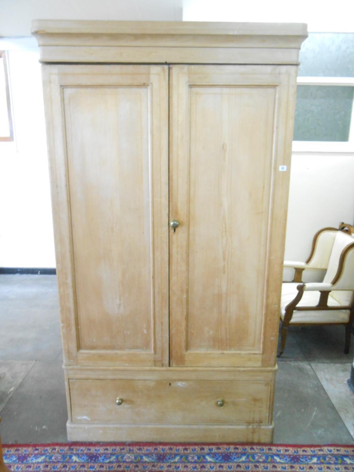 A Victorian Pine Wardrobe Fitted Two Panelled Doors And Base Drawer