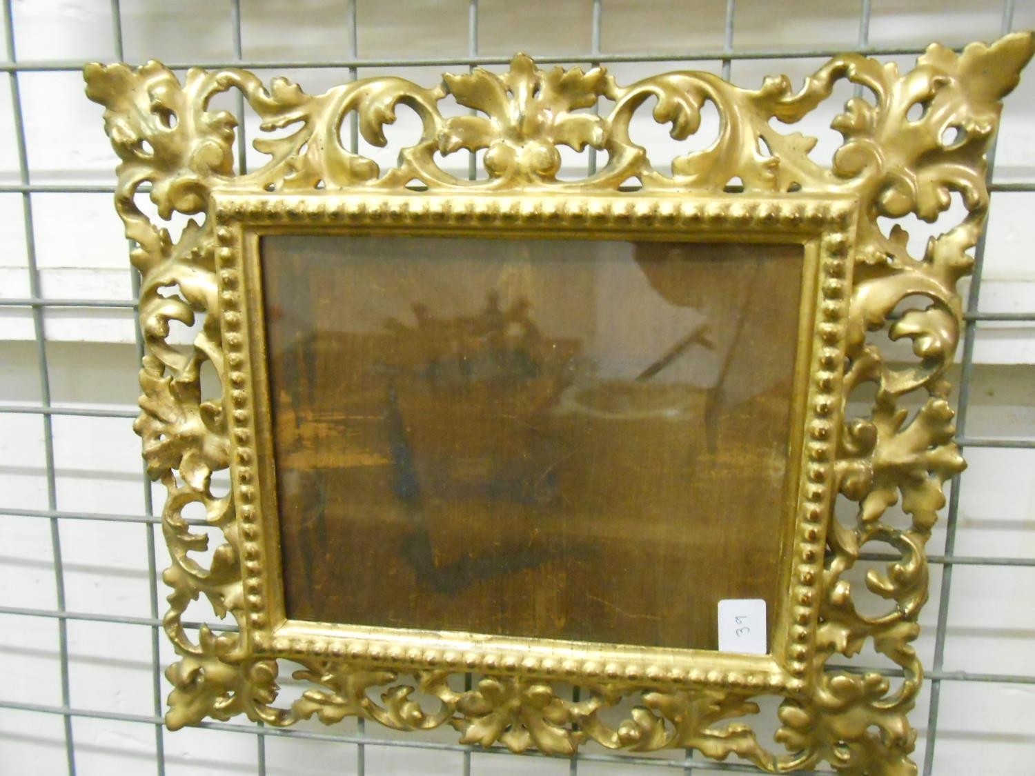 An oak picture frame with carved decoration 31in. x 20in. and a small