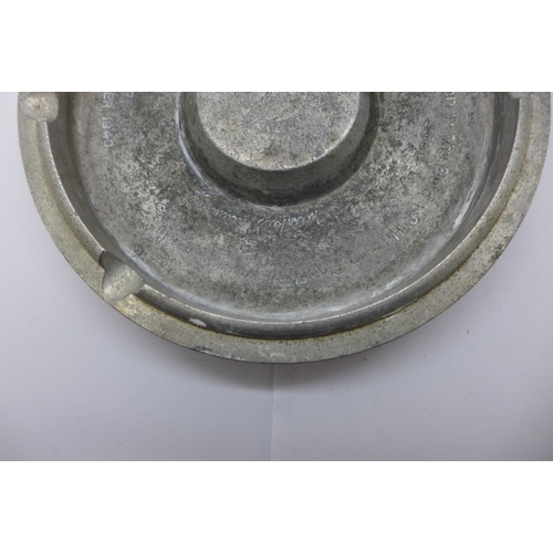 665 - An ashtray marked 'Made from a Rolls Royce Merlin engine piston as used in the Battle of Britain Aug... 